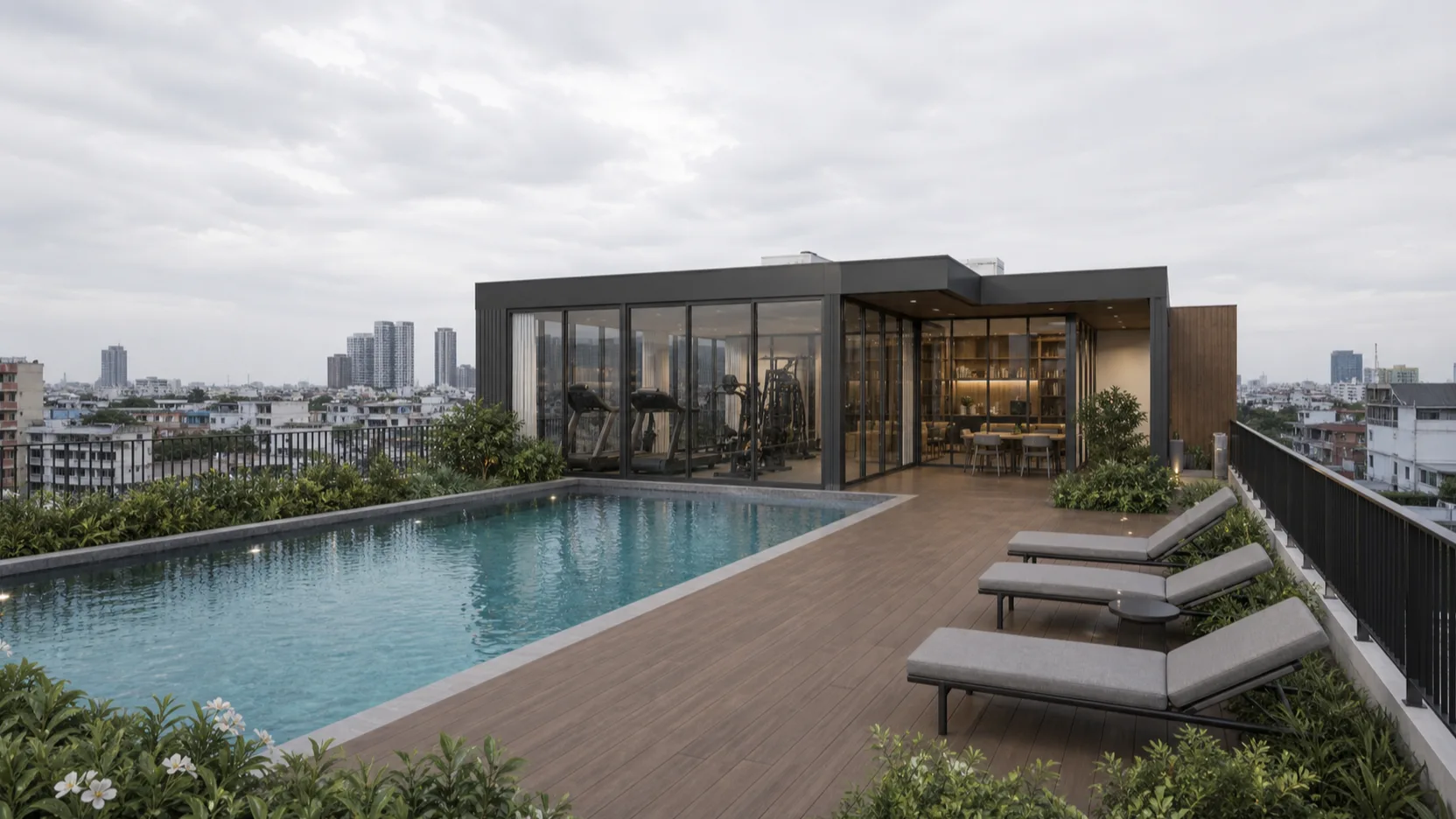 Render of the NODE Rama 9 rooftop amenity floor — an 18 m lap pool, a garden deck, a glazed gym and co-working lounge, the Bangkok skyline beyond, flat daylight.