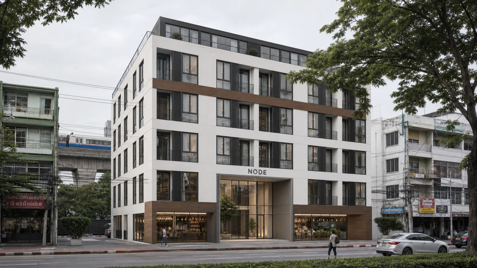 Architectural render of NODE Rama 9 — an 8-storey condominium on a Bangkok soi, white render and dark aluminium, the covered ground-floor entrance, street trees, overcast daylight.